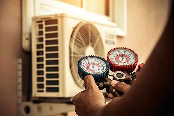 Professional Air Conditioning Service technician working in Saint Paul, OR